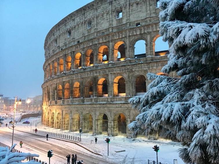 Snow over Colosseum in Rome, Italy
