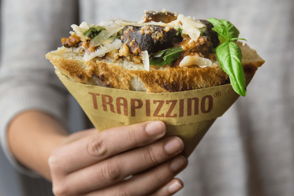 Person holding Italian Trapizzino in front of the camera.